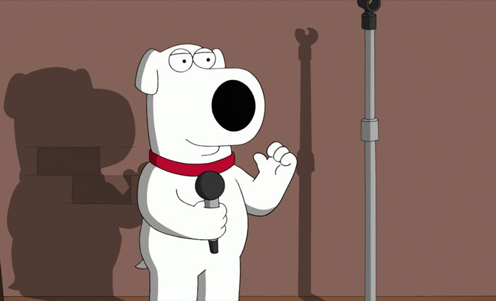 Brian Griffin standing on a stage 