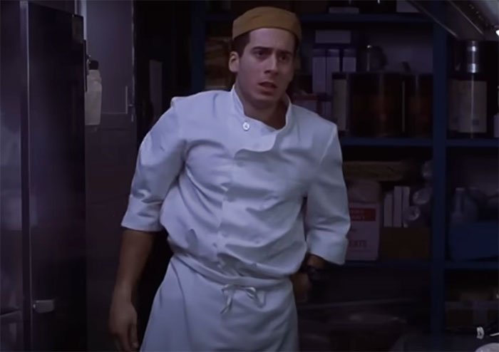 Dinner Rush character wearing chef clothes and brown hat