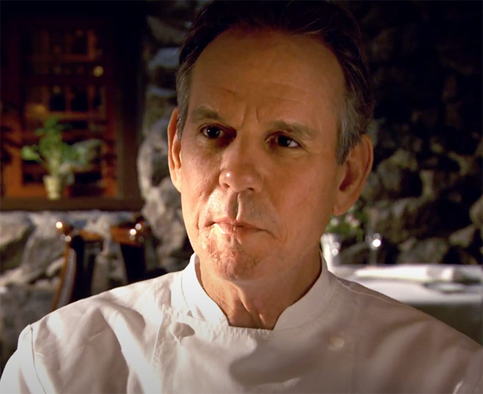 Spinning Plates character wearing chef clothes