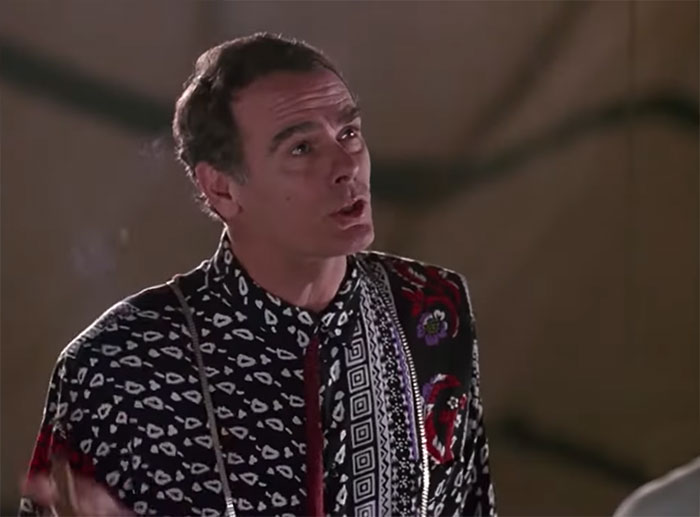 Dean Stockwell looking up and talking 