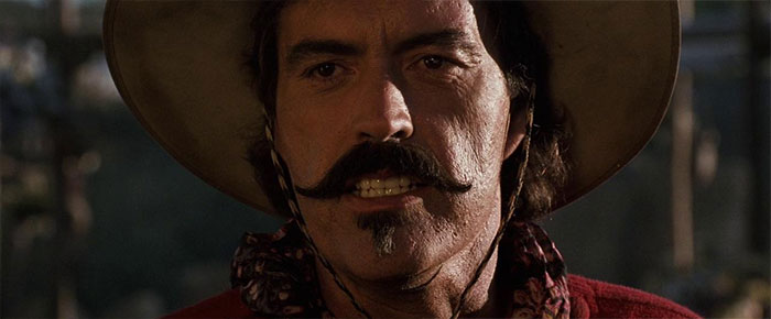 Powers Boothe looking angry 