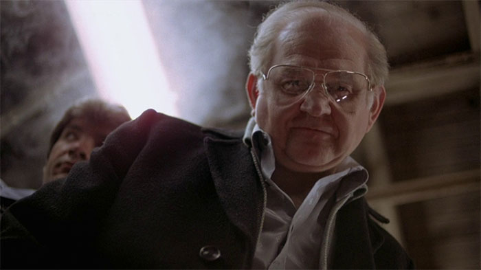 Robert Prosky looking down on someone 