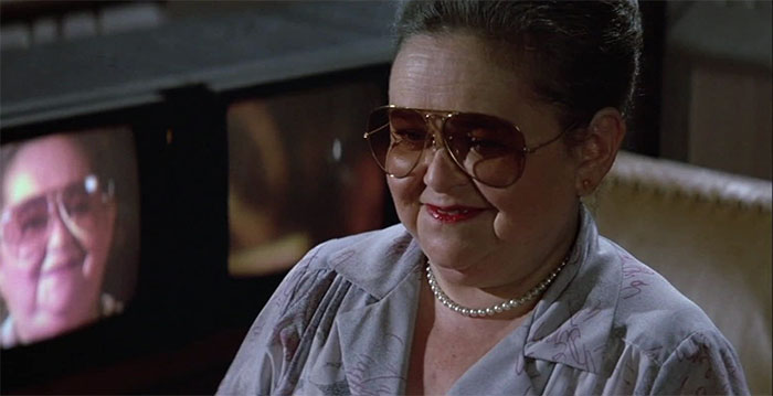 Zelda Rubinstein laughing with her sunglasses 