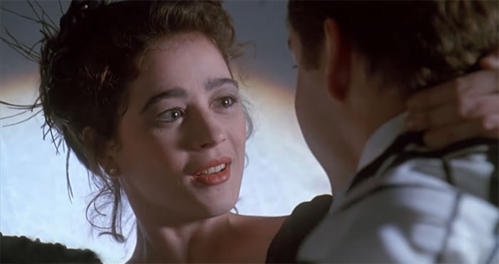 Moira Kelly looking at someone and hugging 