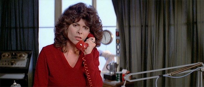 Adrienne Barbeau talking to a cellphone 