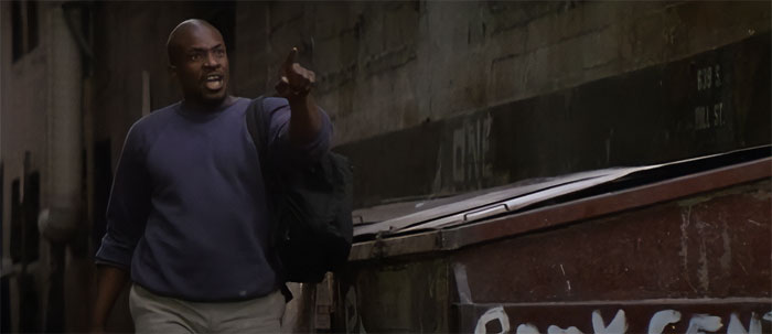 Keith David talking to someone and pointing a finger at someone 