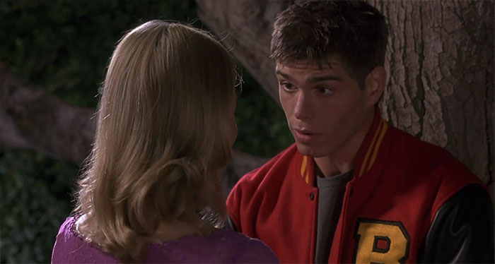 Matthew Lawrence looking at a girl and talking 