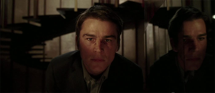 Josh Hartnett looking at someone in the dark 