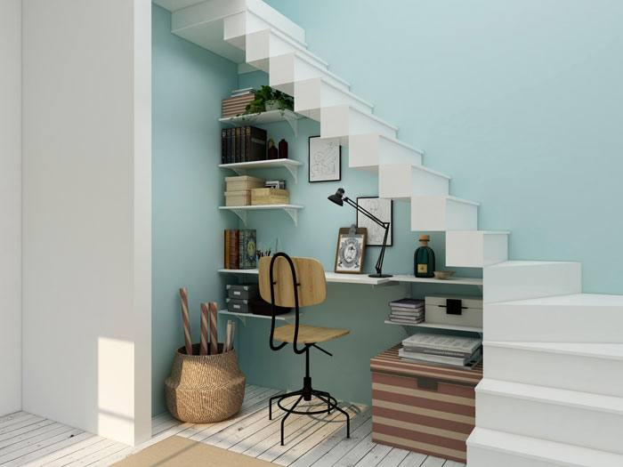Under-stair home organization idea with shelves, desk, chair, and storage boxes.