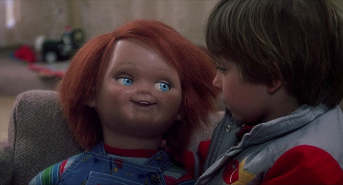 A boy talking with Chucky 