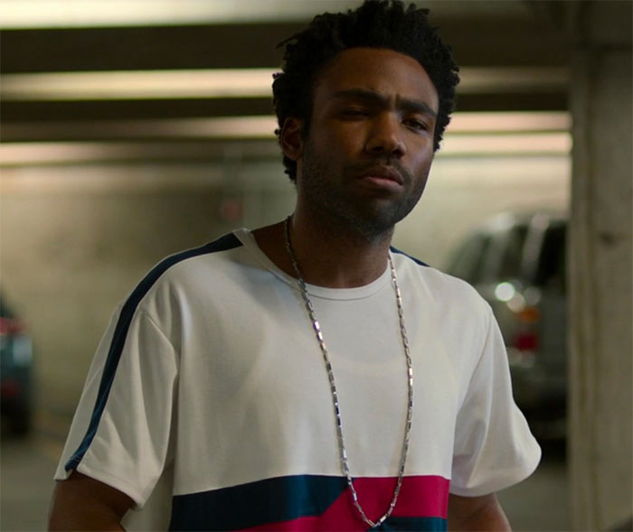 Donald Glover standing and looking in movie Spider-Man: Homecoming