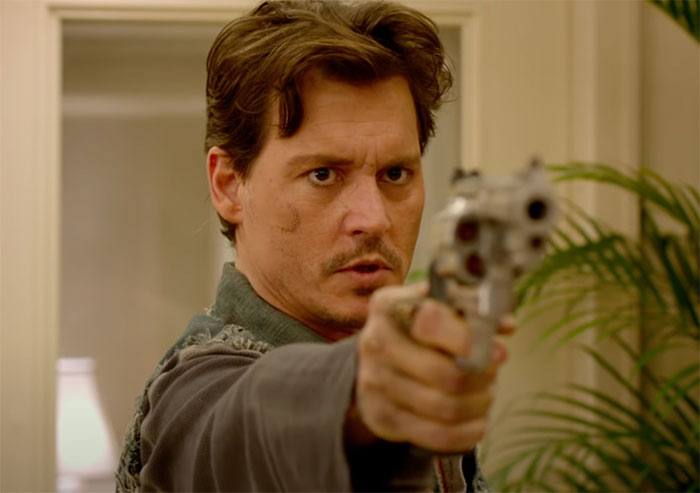 Johnny Depp holding gun in movie 21 Jump Street