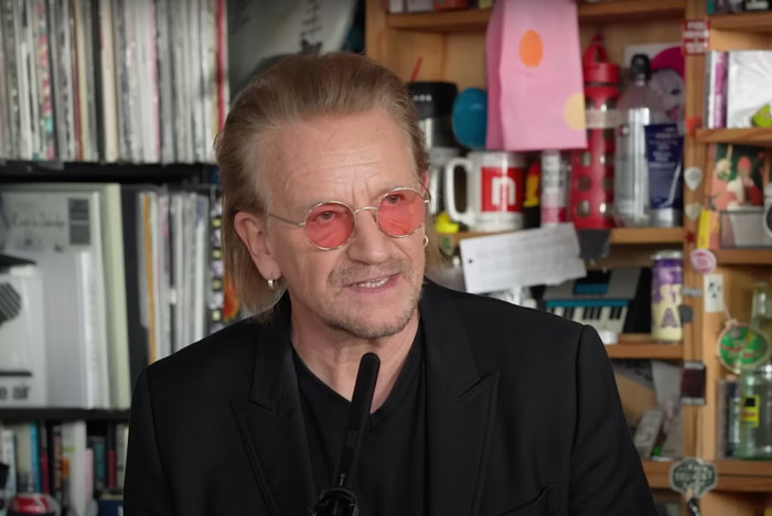 Screen photo of Bono gives an interview