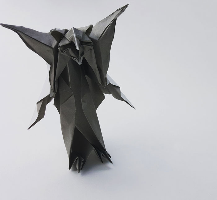 a black origami owlbear