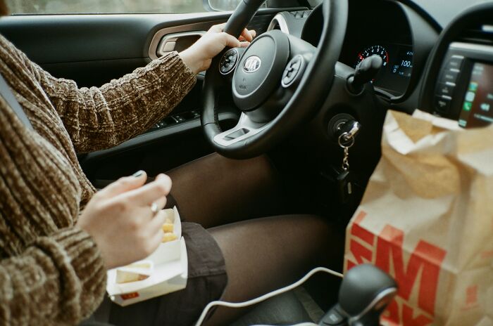 Woman Eating McDonald's In Her Car 