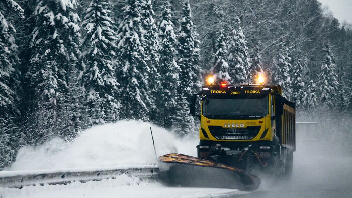 Snowplow cleaning the road 