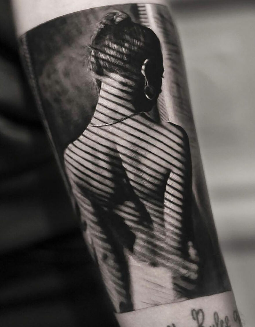 Realistic young woman back with striped shadows on her tattoo