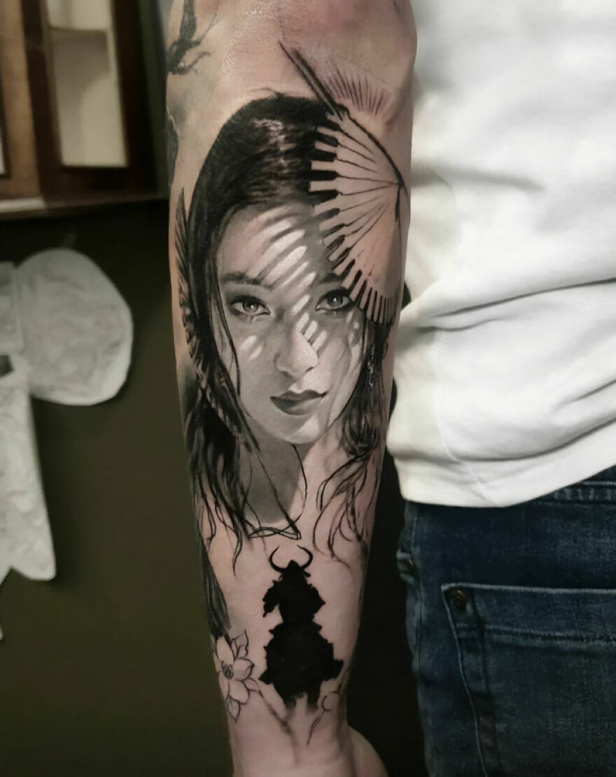 Girl portrait and warrior tattoo on arm