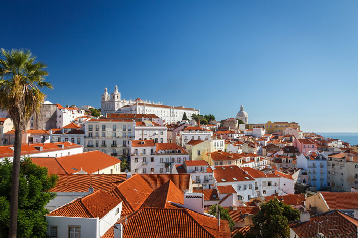 Lisbon's red roof top view with colorful buildings 