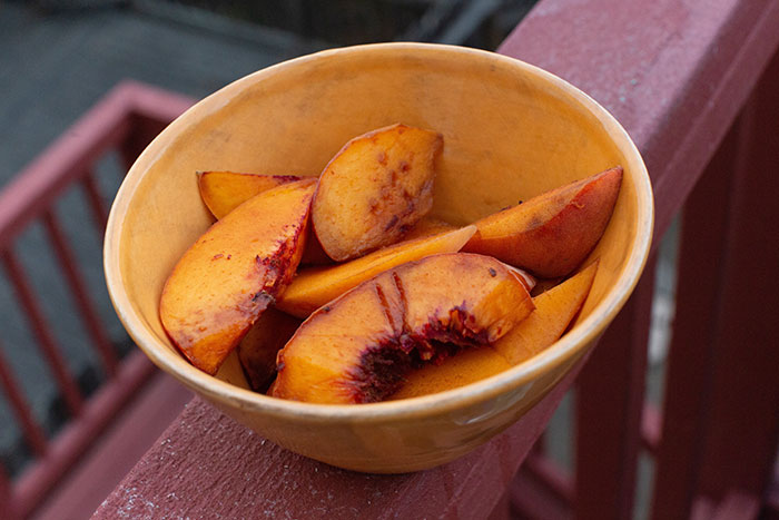 sliced fruits served in ceramic bowl