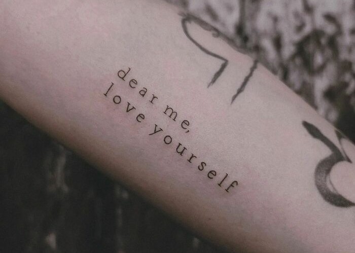 Dear me love yourself quote arm tattoo