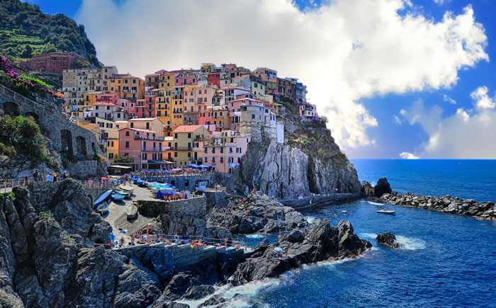 Photo of Amalfi Coast city with buildings beside of water