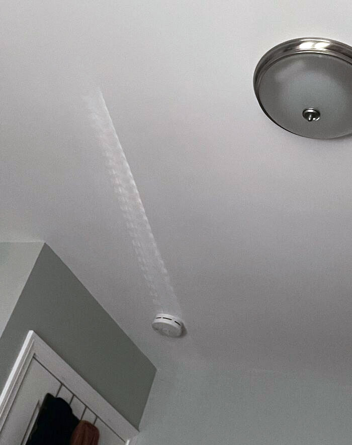 The Way The Light Is Hitting My Smoke Detector Makes It Look Like It's Sliding Across The Ceiling