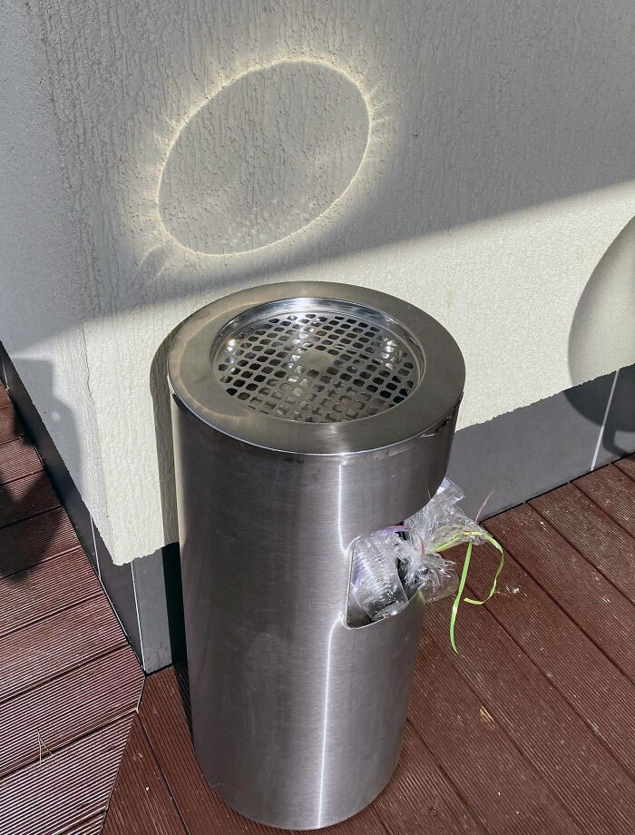 This Trashcan Reflects Light In Such A Way That Makes It Look Like A Solar Eclipse