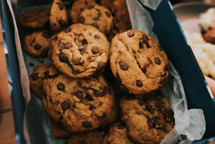 Many chocolate cookies on the baking tray