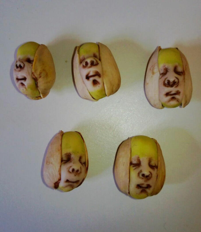 Carved faces on the pistachios 