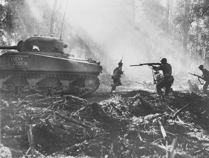 Pictured Above Are American Troops Belonging To The 29th Infantry Regiment Advancing With An M4 Sherman During March 16th, 1944 On The Island Of Bougainville
