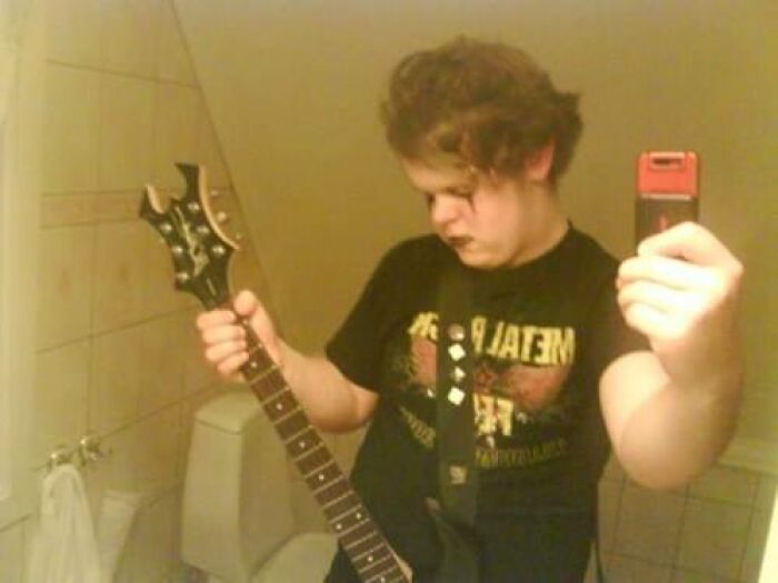 Q- What's Worse Than A Goofy Metal Kid With Sh*t Hair And Makeup, Posing By A Toilet? A- A Goofy Metal Kid With Sh*t Hair And Makeup, Posing By A Toilet With A B.c Rich