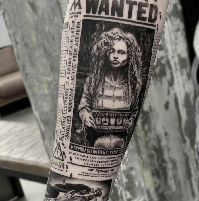 Harry Potter tattoo featuring a detailed Azkaban prison poster on an arm.