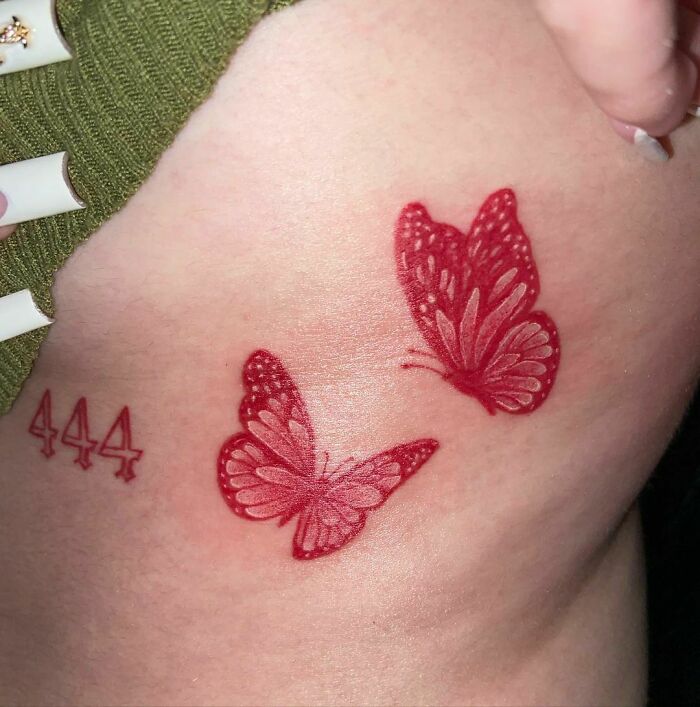 Red butterflies tattoo 