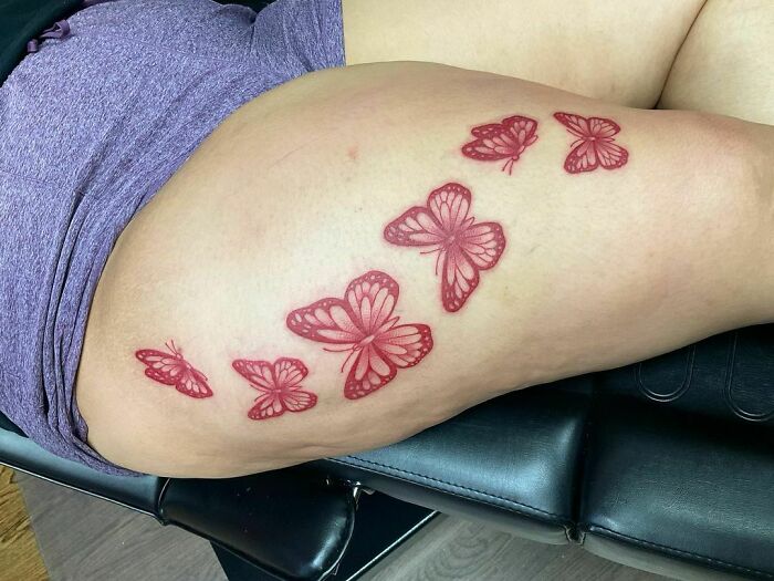 Red butterflies tattoo