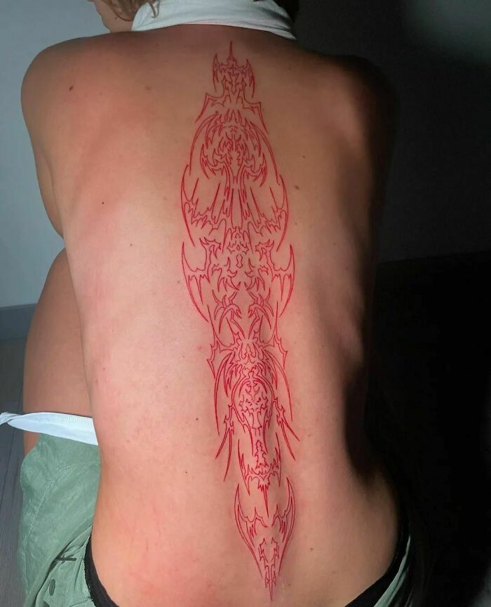 23 Red Ink Tattoo To Stand Out  Red tattoos, Spine tattoos for