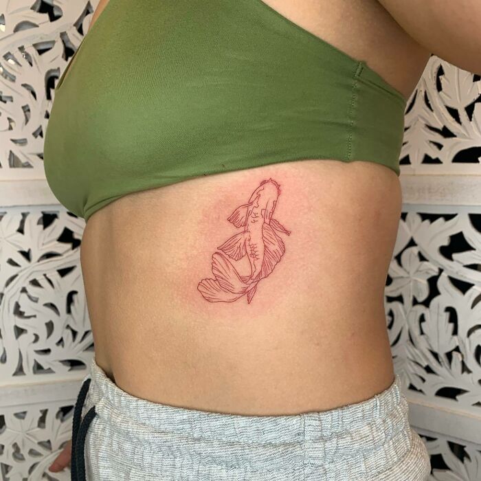 Red Koi ribs tattoo 
