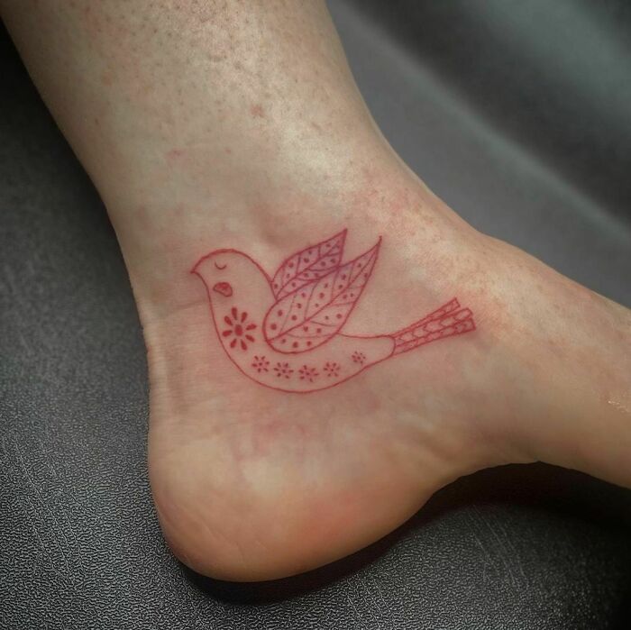 red bird tattoo 