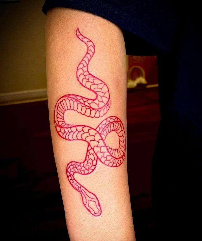 Red snake arm tattoo 