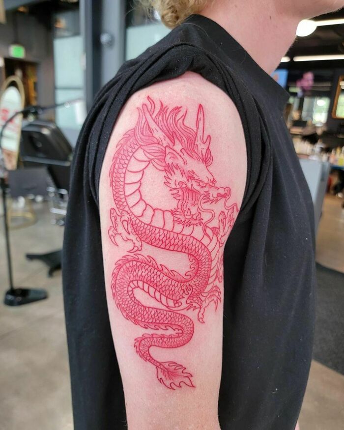Red dragon arm tattoo 