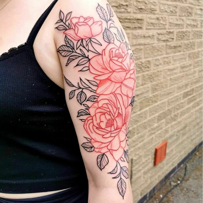 Red roses arm tattoo