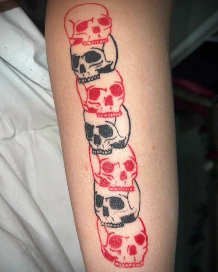 Red and black skulls tattoo 