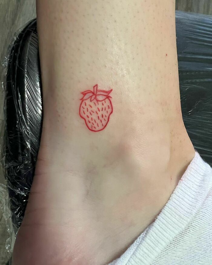 Little red strawberry tattoo 