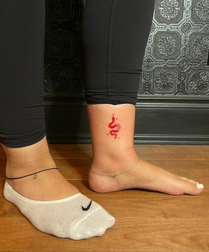 Red Ink Small Snake Tattoo
