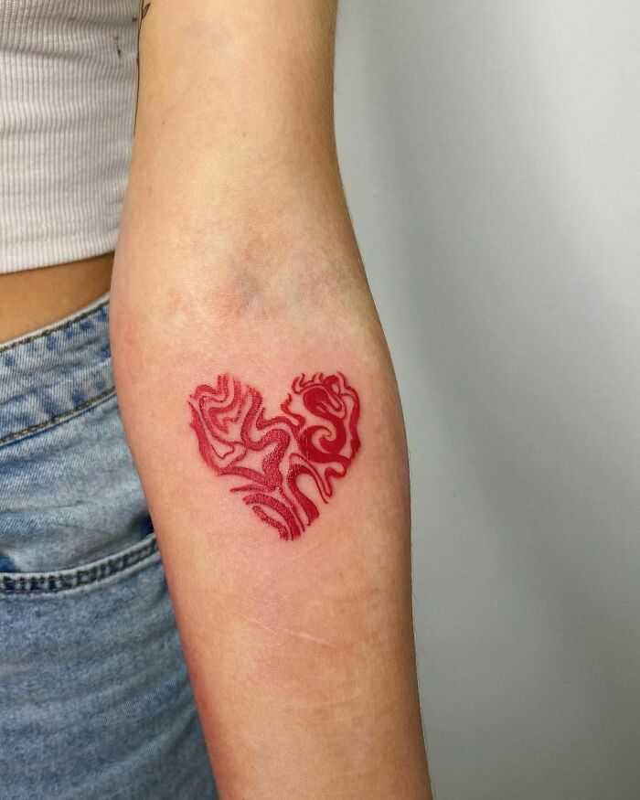 Red ink heart tattoo