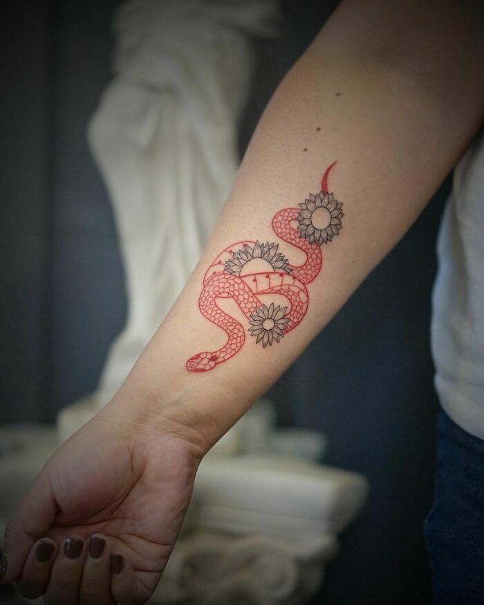 red snake and flowers tattoo 