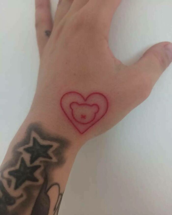 Heart and bear red tattoo 