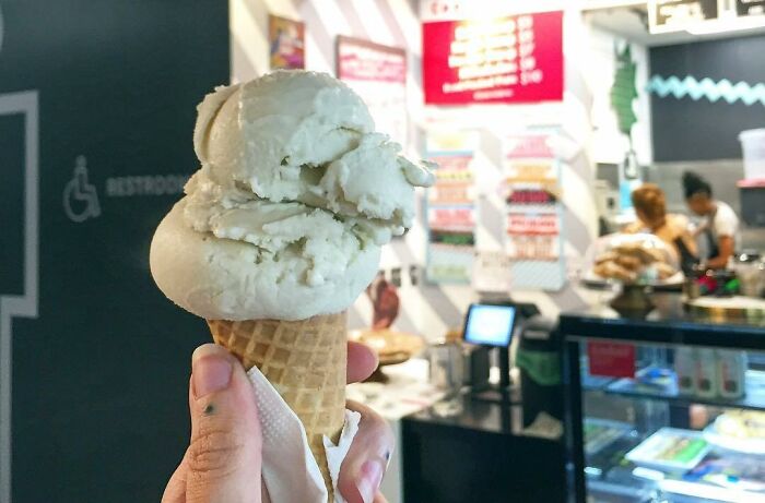 Person holding sushi ice cream in the cone 