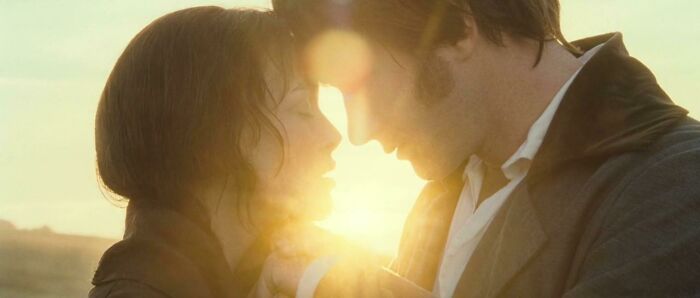 Mr. Darcy and Elizabeth kissing in front of the sun