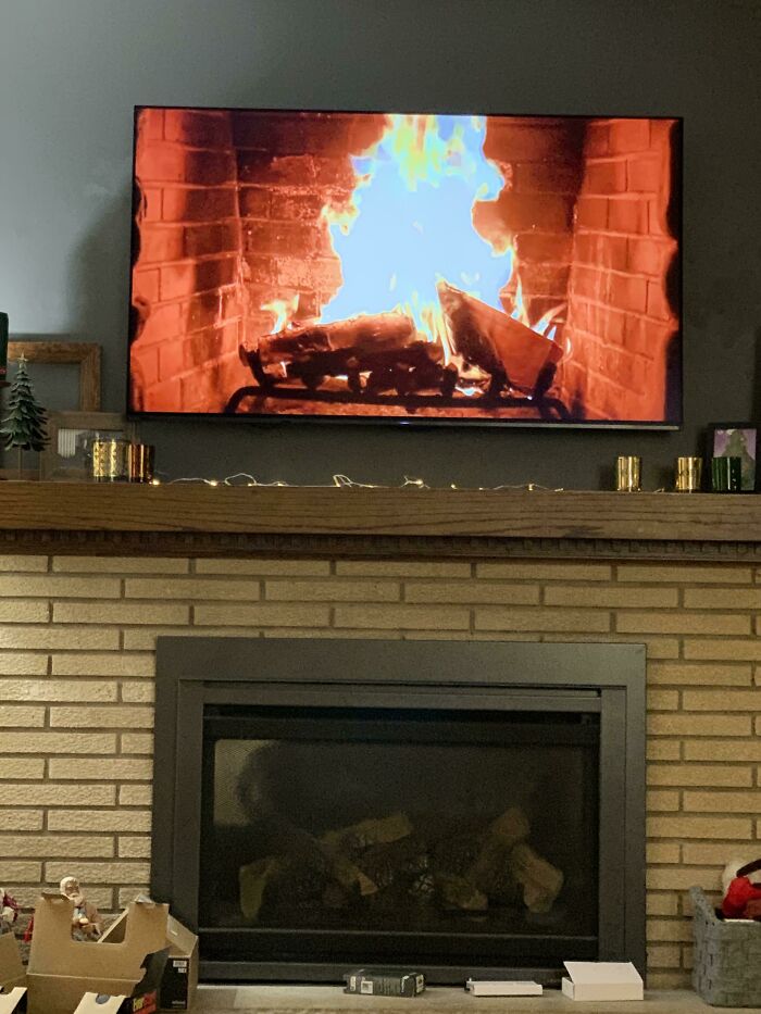 My Mom Put A Fireplace Video On The Living Room TV That’s Directly Above Her Actual Fireplace